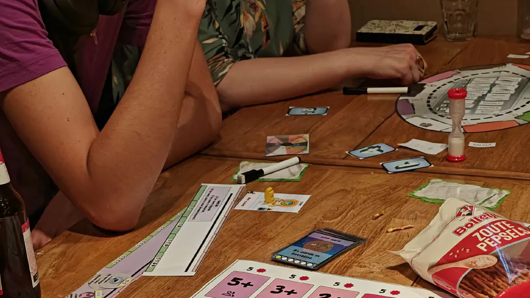 A group of people playtesting a boardgame.