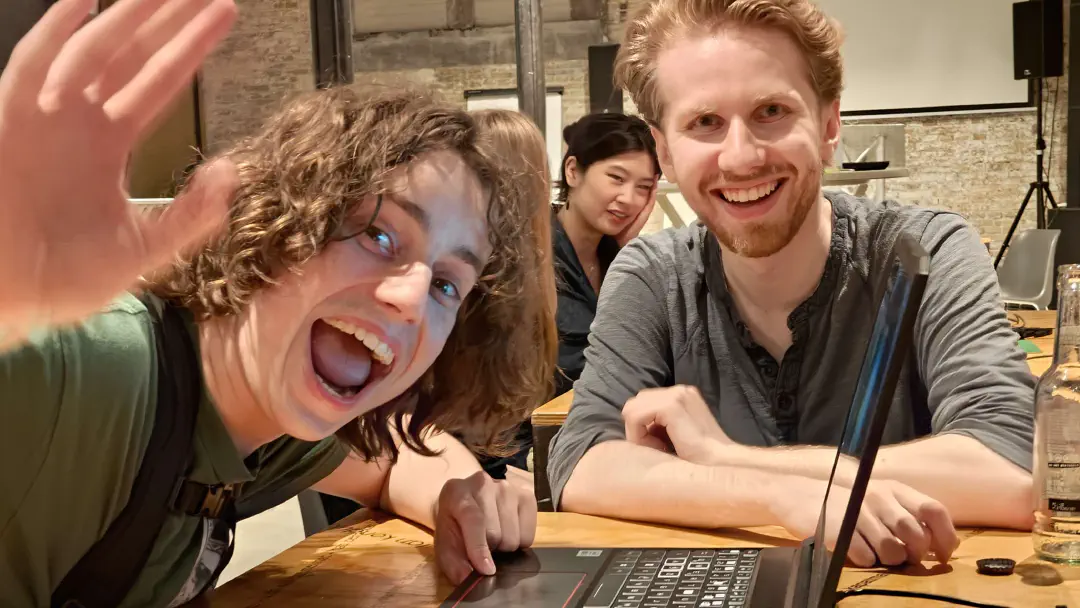 Photograph taken during a previous Open Dev Mix. People are greeting the photographer happily!